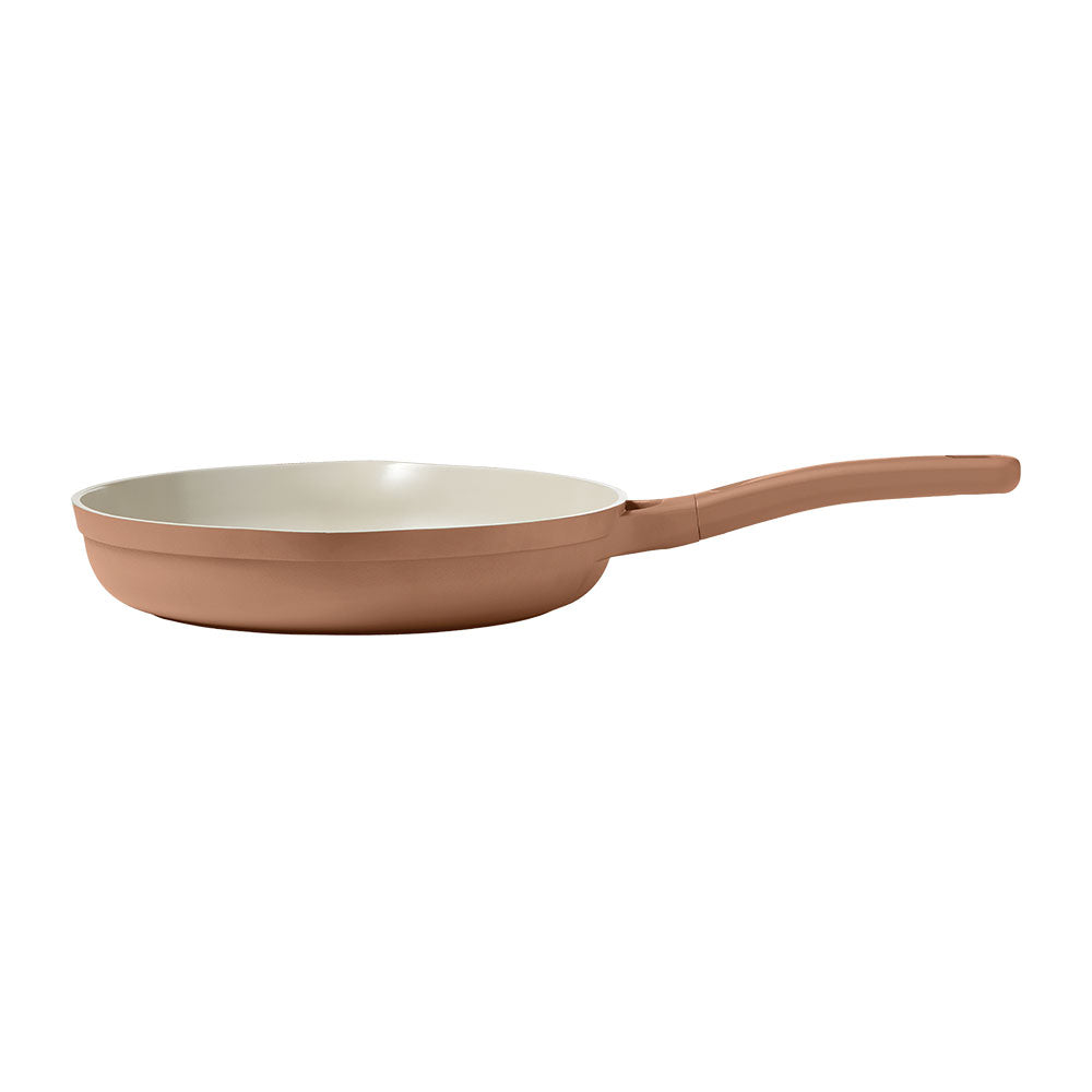 Frying pan with a terracotta handle on a white background