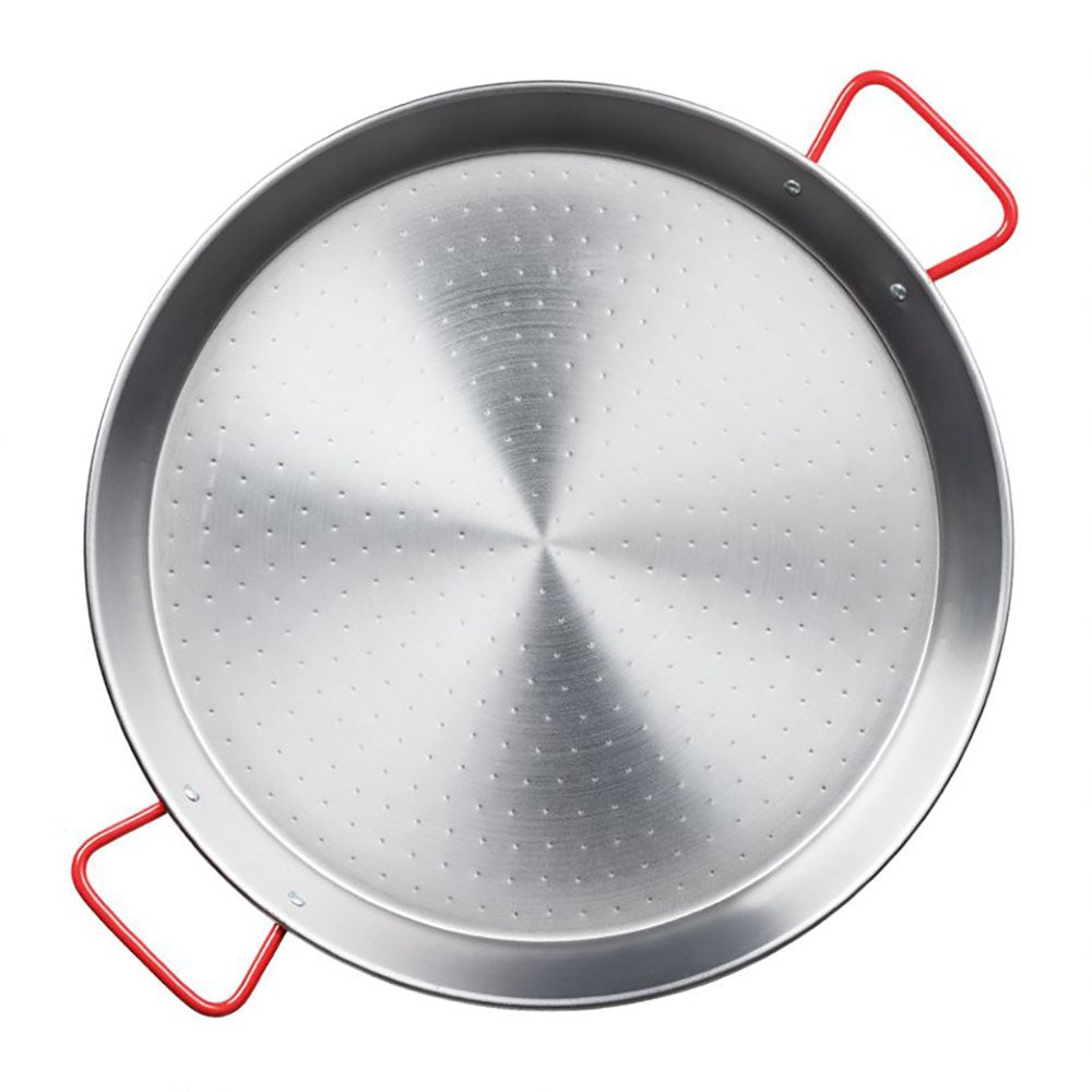 Two Baccarat Autentica 42cm Paella Pans on a wall above a countertop filled with kitchen items