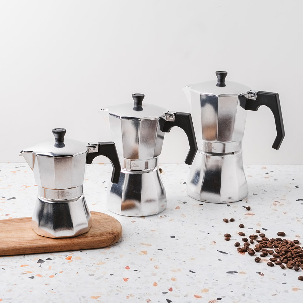 A polished and sleek stovetop espresso maker with an ergonomic handle - Baccarat Barista Brillante