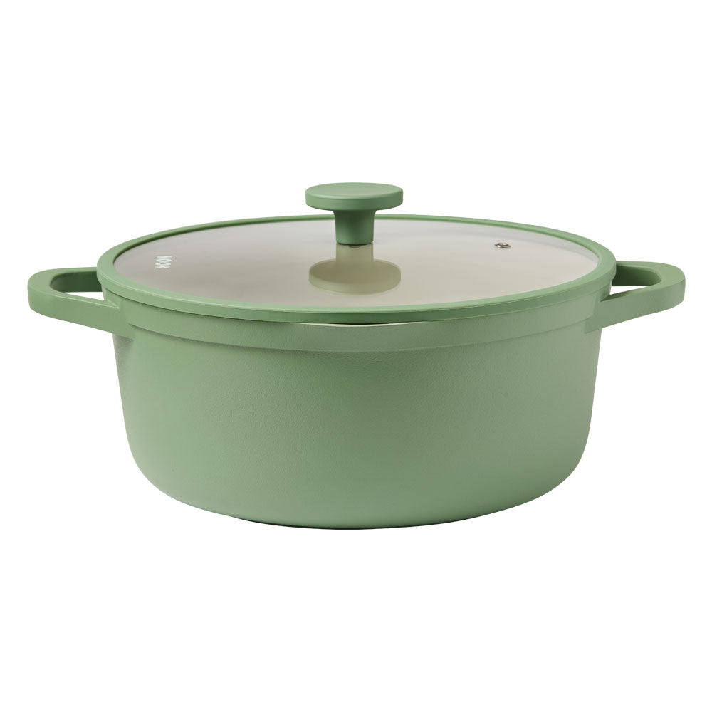 A sage green enameled cast iron pot with a matching lid and side handles, shown on a solid white background.