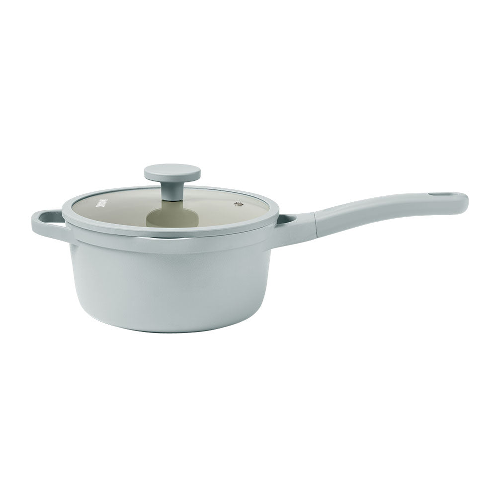 Sky-coloredsaucepan with a lid on a white background