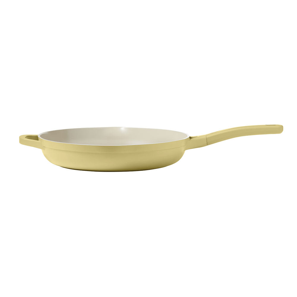 Yellow frying pan on a white background