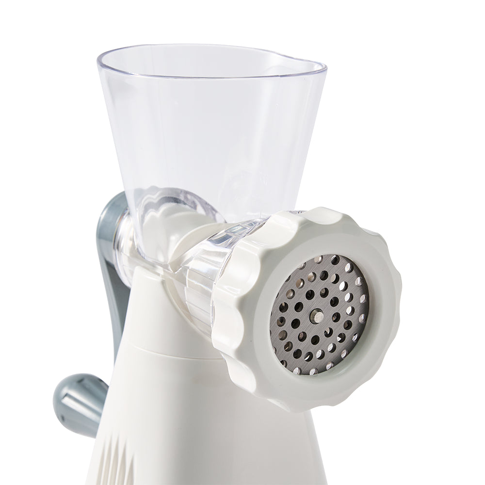 White manual meat grinder with clear container on a white background