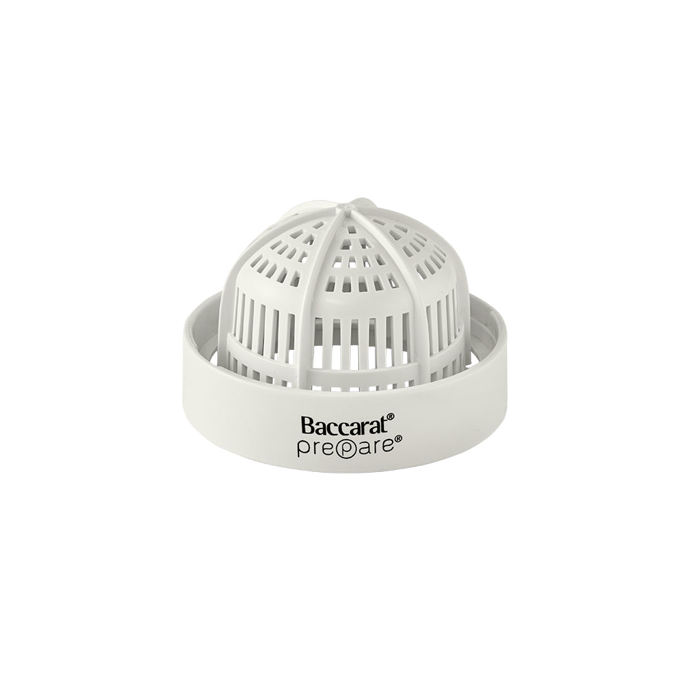 A white protective strainer basket for the juicer attachment is displayed.