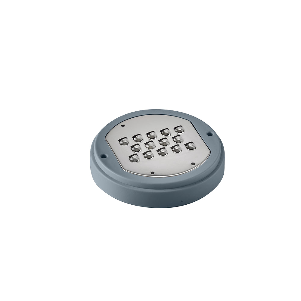 A dark grey circular grater disc with multiple protruding wavy blades is presented.