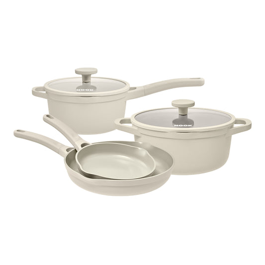 NOOK by Baccarat 4 Piece Cookware Set Cream on a white background.
