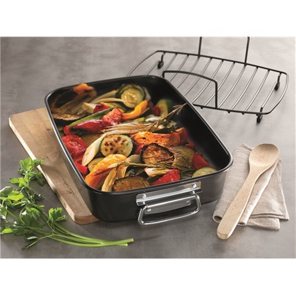 A roasting pan with vibrant vegetables and black finish - Baccarat gourmet roaster with rack 