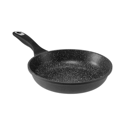 A frying pan with two sunny-side-up eggs on a kitchen counter granite frypan 26cm - Baccarat