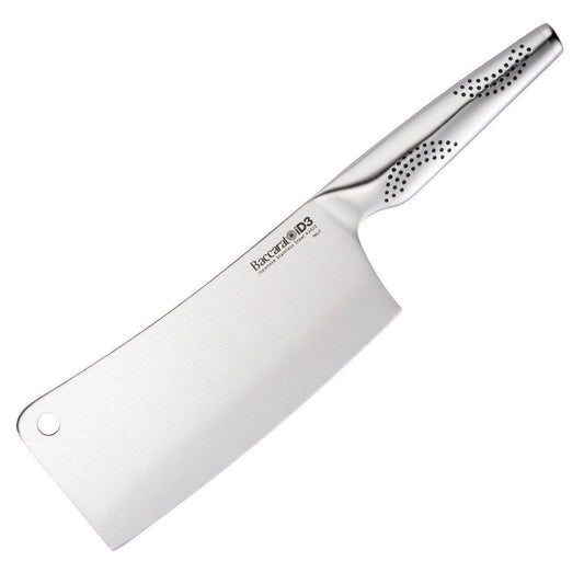 Person slicing watermelon with a cleaver next to a salad on a gray countertop - Baccarat