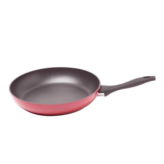 A smooth non-stick surface with a vibrant red finish and ergonomic black handle - Baccarat