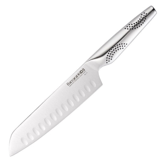 A person slices a red onion on a wooden board with a sharp knife - Baccarat id3 santoku knife 18cm