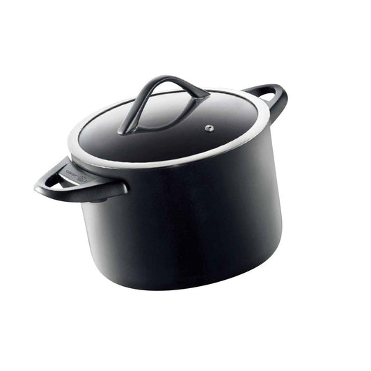 Round black stockpot with lid and bakelite handle filled with chopped carrots and greens - Baccarat