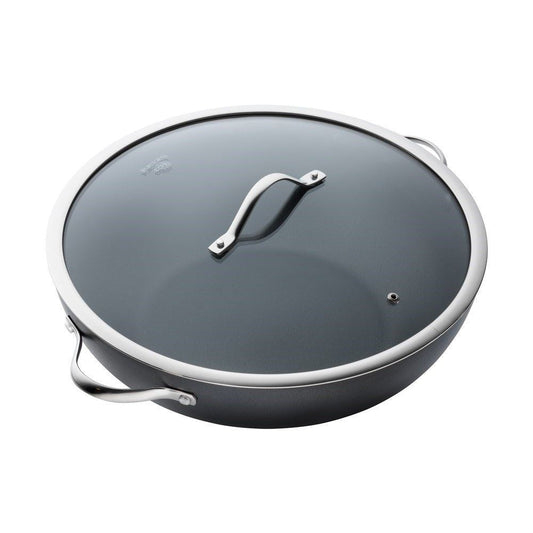 A vibrant array of sliced vegetables in a non stick wok with lid - Baccarat id3 hard anodised 36cm