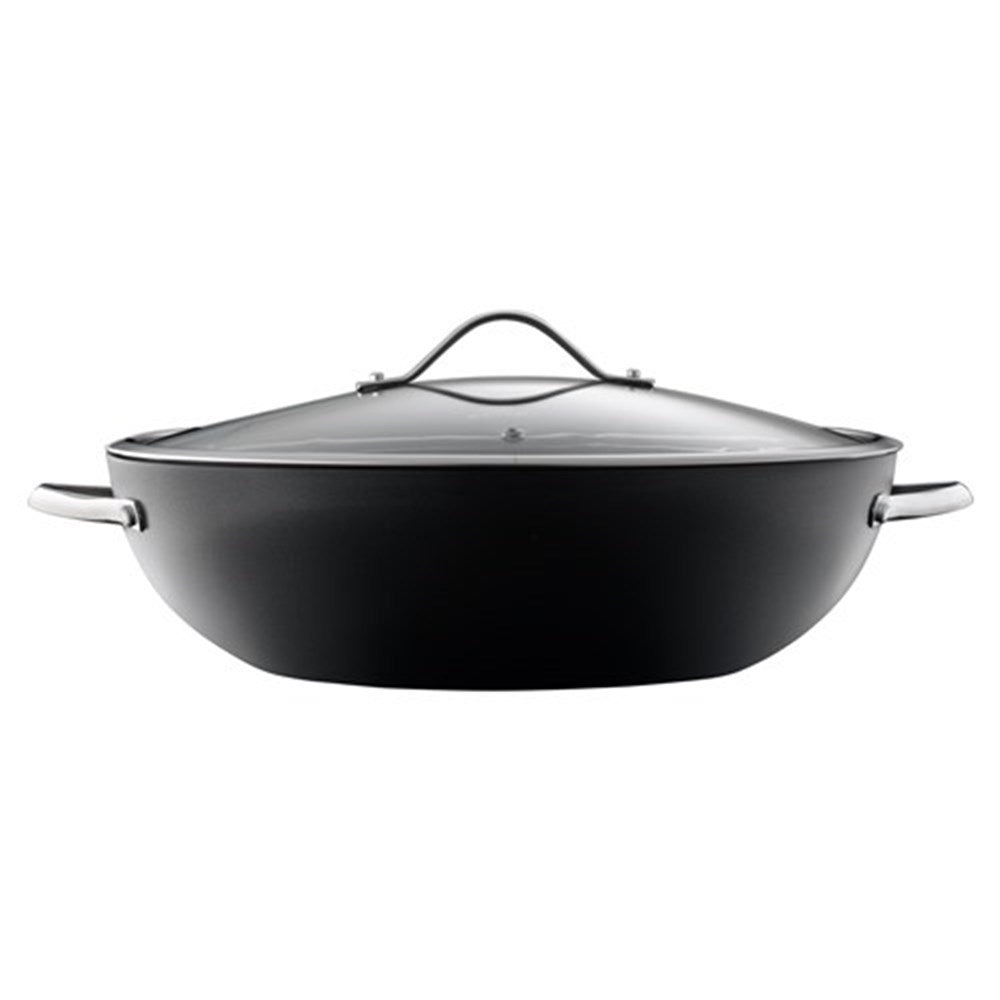 A vibrant array of sliced vegetables in a non stick wok with lid - Baccarat id3 hard anodised 36cm