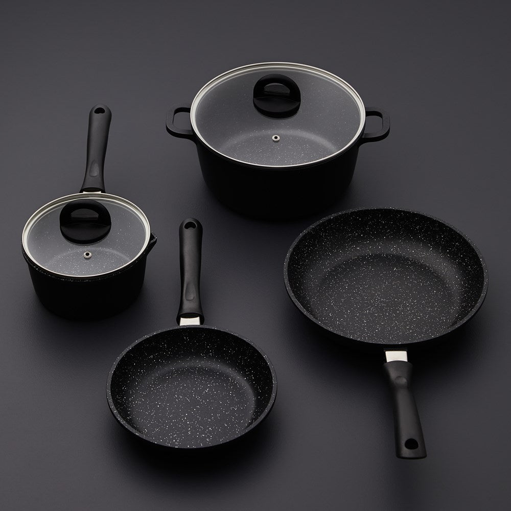 Baccarat Stone 4-piece Cookware Set features pots and pans with olive oil and pasta on a countertop 