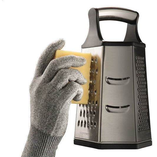 Grating cheese with a protective glove on a stainless steel grater with a sleek design - Baccarat