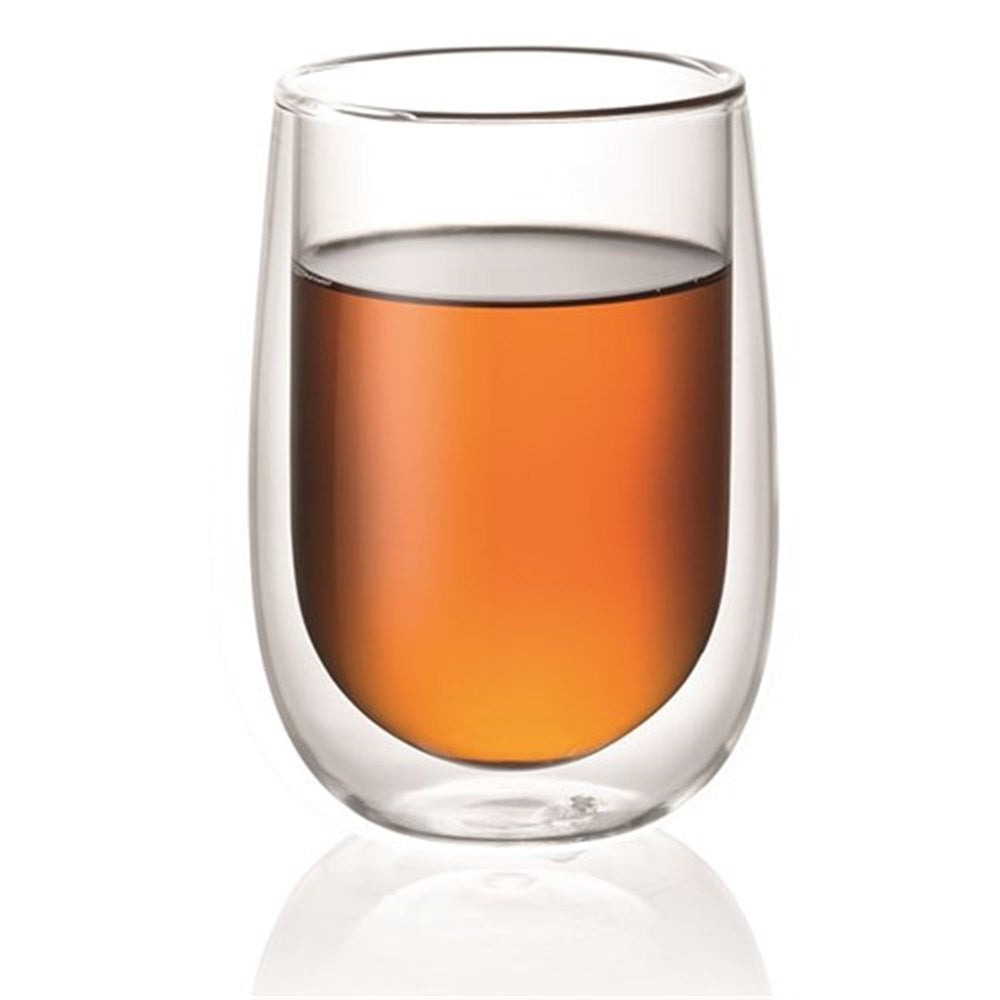 hot coffee in double-walled glass mug on wooden plate with spoon next to empty glass - Baccarat