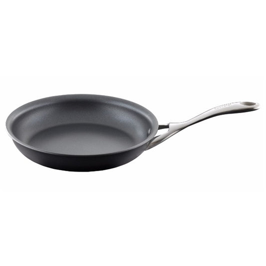 Close-up of a sleek hard anodised frypan with a smooth surface and vibrant herbs - Baccarat