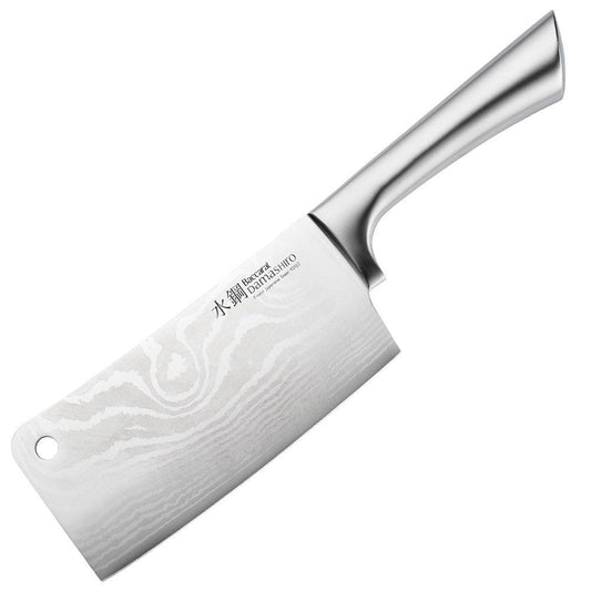 A Baccarat Damashiro cleaver with a sleek finish on a rustic surface surrounded by fresh ingredients