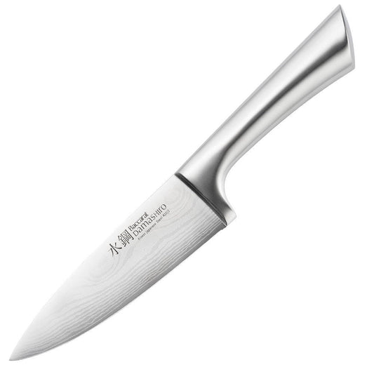 A Baccarat Damashiro Mini chef knife in a protective box with a polished blade and ergonomic handle