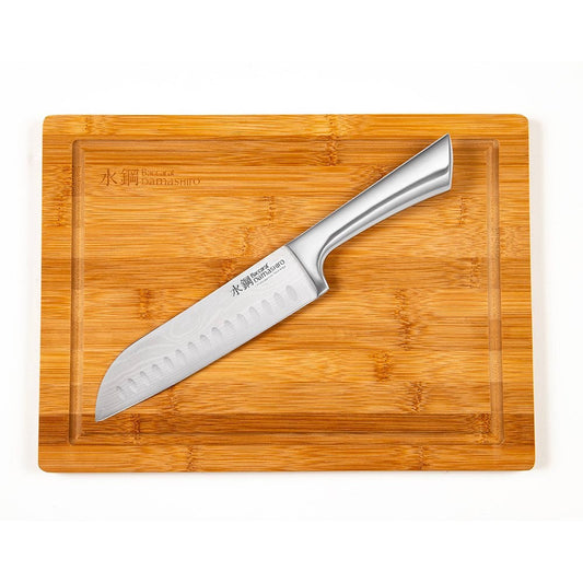 Sliced sandwich on a wooden board with a knife cheese and fresh ingredients - Baccarat damashiro