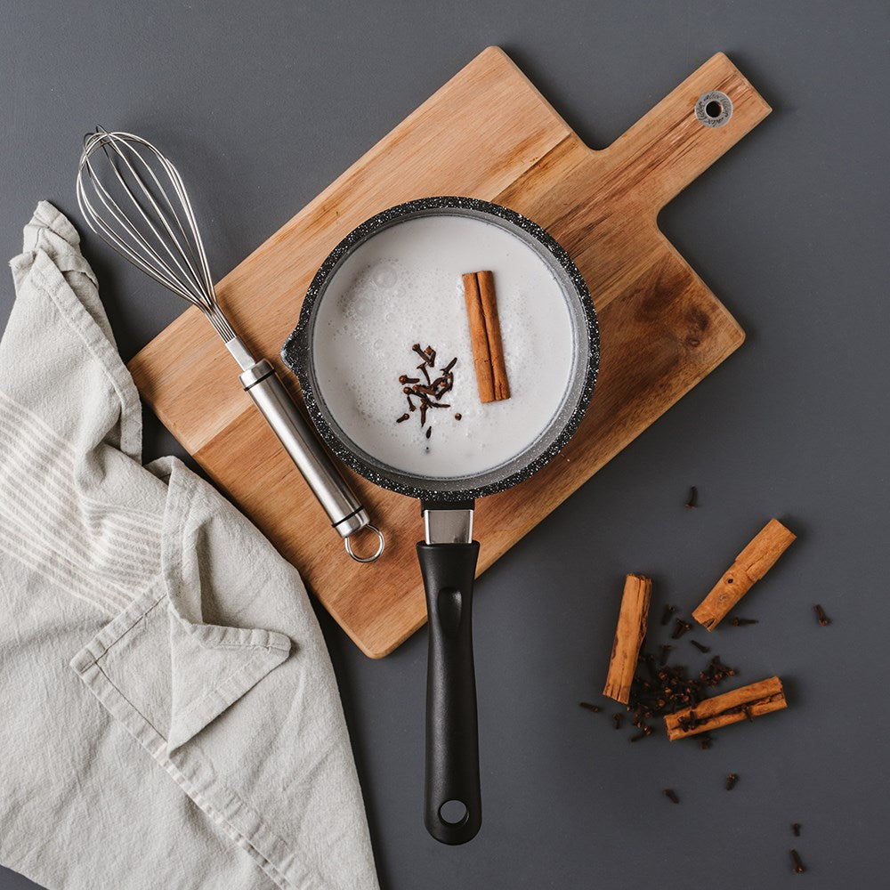 Flat lay saucepan milk cinnamon whisk cloth wooden board neutral tones - 1l milk pan 16cm - Baccarat