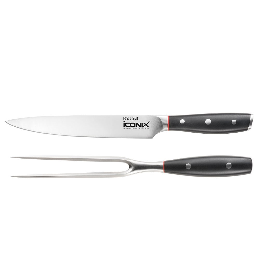 Sleek black-handled carving knife with silver blade beside its Baccarat packaging - Baccarat Iconix