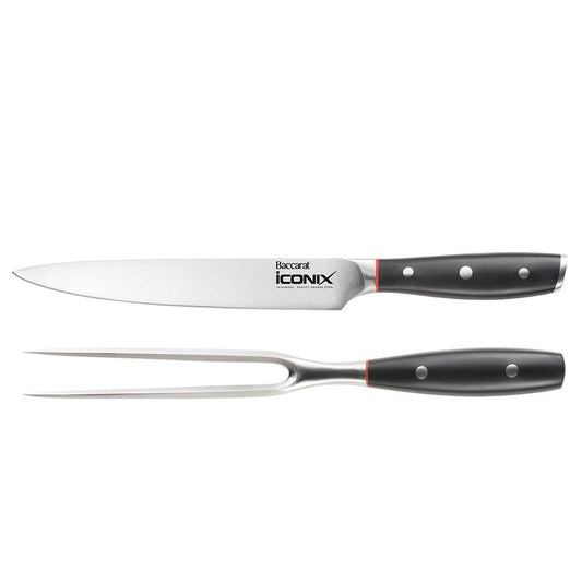 Sleek black-handled carving knife with silver blade beside its Baccarat packaging - Baccarat Iconix