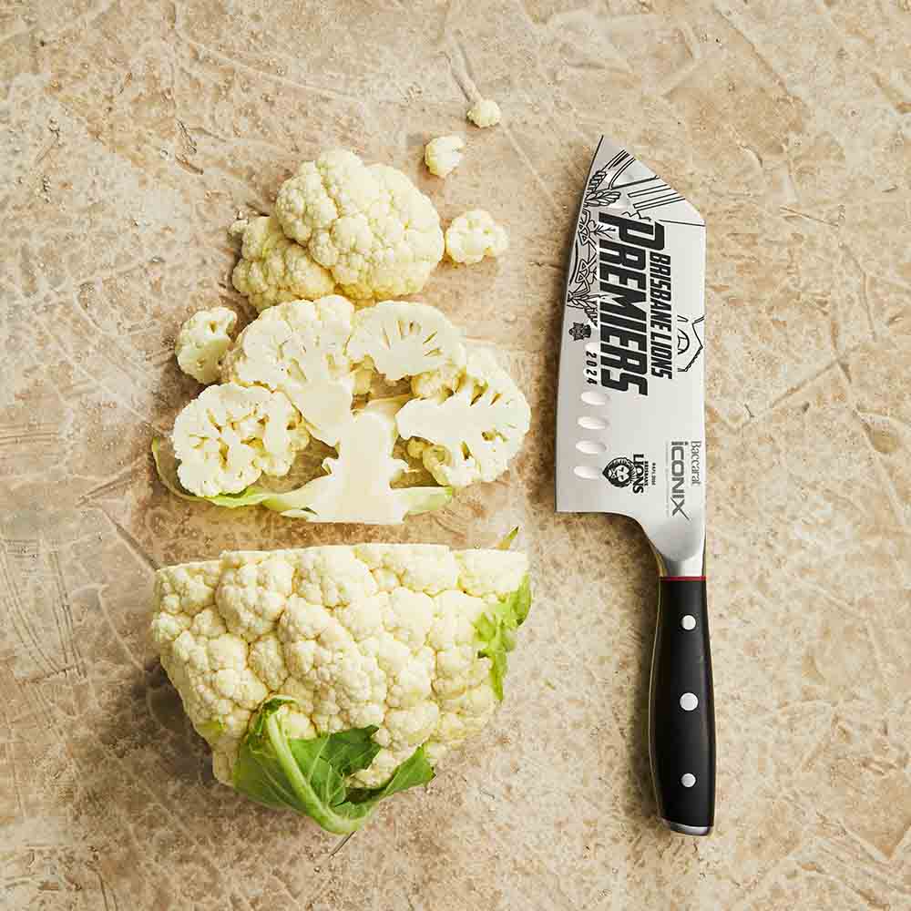 Sliced cauliflower next to a 17 5cm textured surface black handle cleaver knife - Brisbane Lions