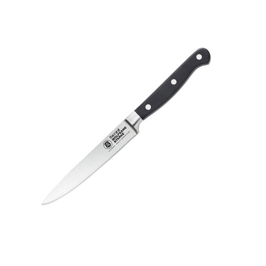 A black-handled knife on a wooden cutting board with sliced strawberries - Baccarat Wolfgang Starke