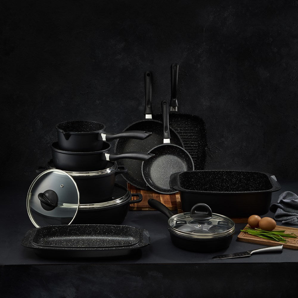 A complete cookware set with pots pans and a grill pan featuring black non-stick surfaces - Baccarat