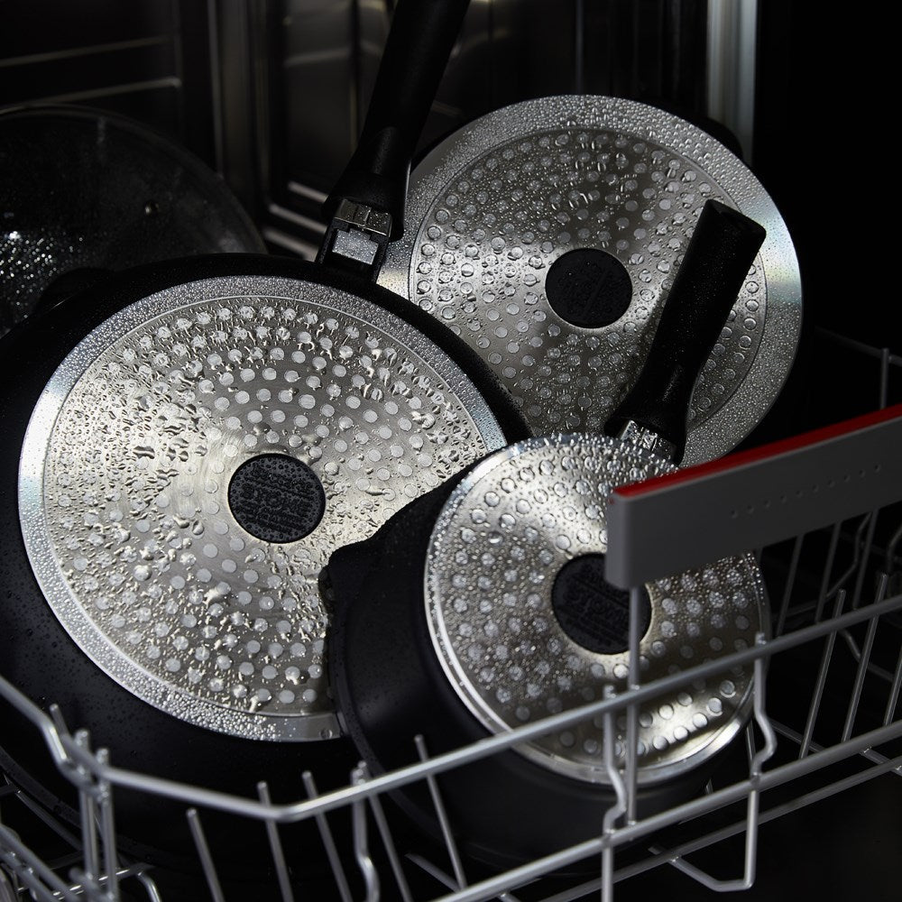 A complete cookware set with pots pans and a grill pan featuring black non-stick surfaces - Baccarat