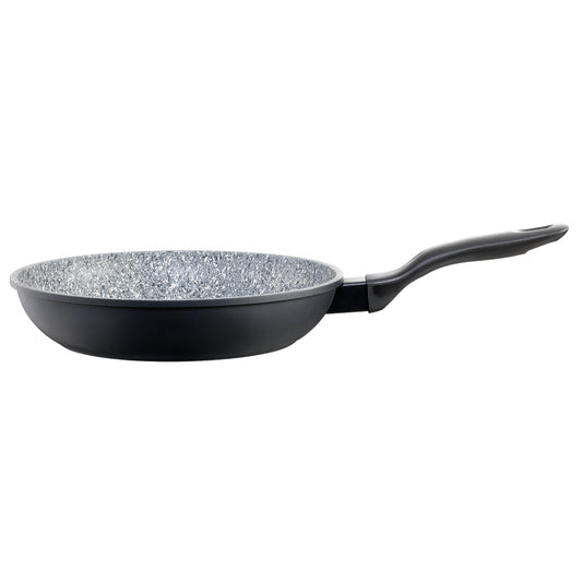 A black frying pan with green peas onions and broccoli on a wooden board 28cm frypan - Baccarat