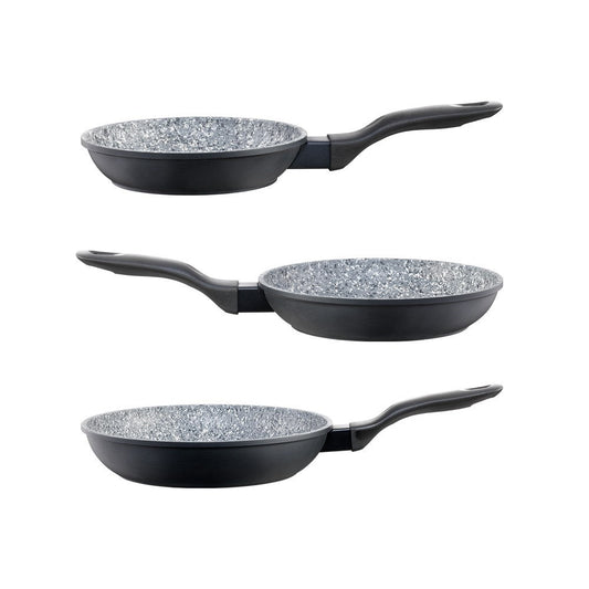 Baccarat stonex2 Ceramic non-stick frying pans of varying sizes with vegetables and a wooden spoon