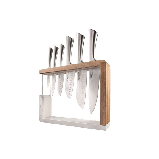 Baccarat Damashiro 7 piece knife block with stainless steel knives on a glossy counter - Baccarat