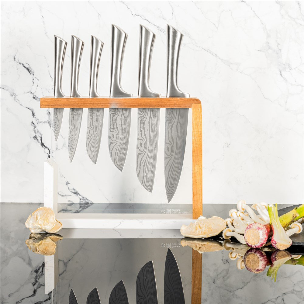 Baccarat Damashiro 7 piece knife block with stainless steel knives on a glossy counter - Baccarat