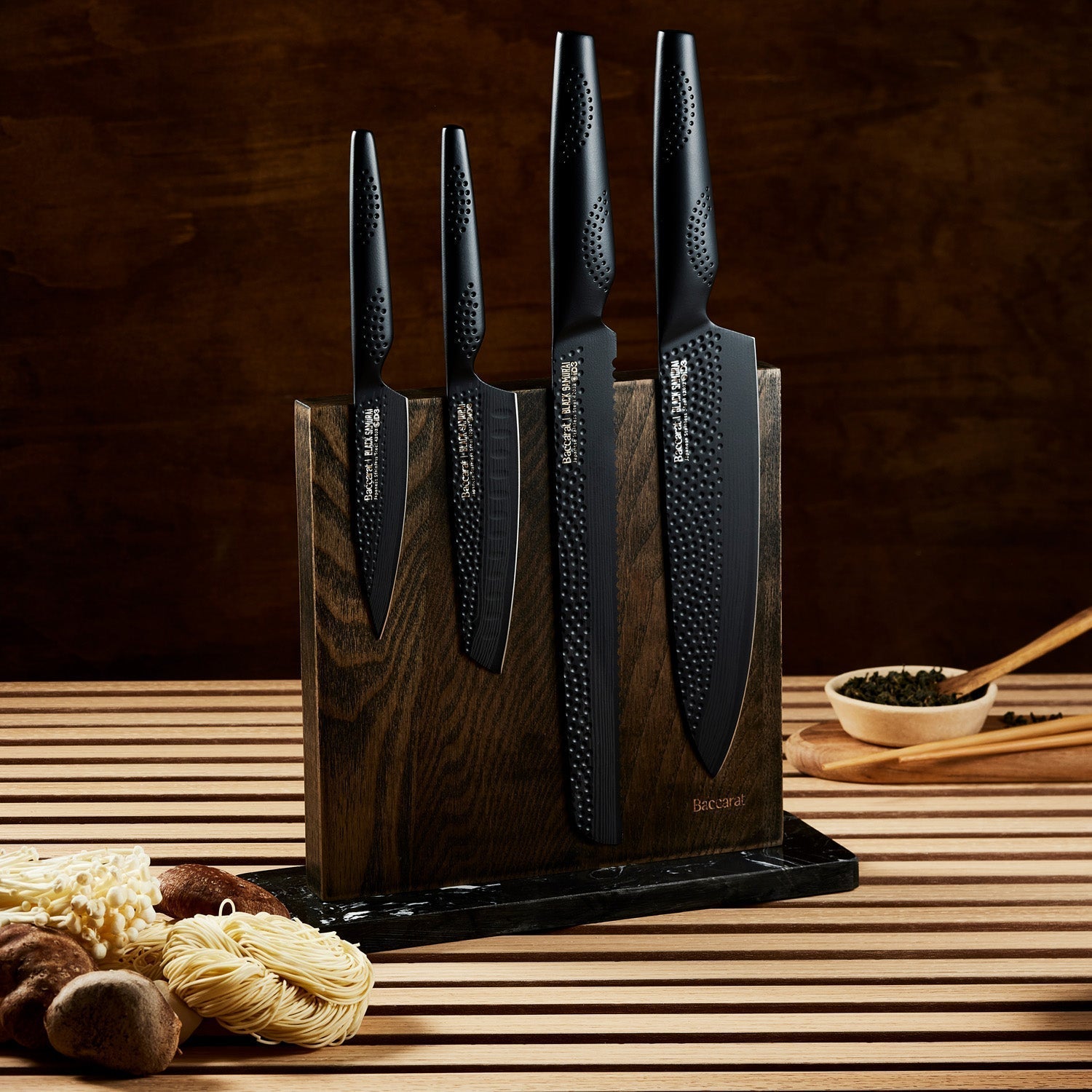 Close-up of two black kitchen knives in a wooden block textured handles colour knives - Baccarat ID3