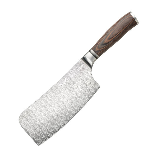 A hand slicing a red tomato with silver cleaver on a wooden cutting board  - Baccarat Le Connoisseur