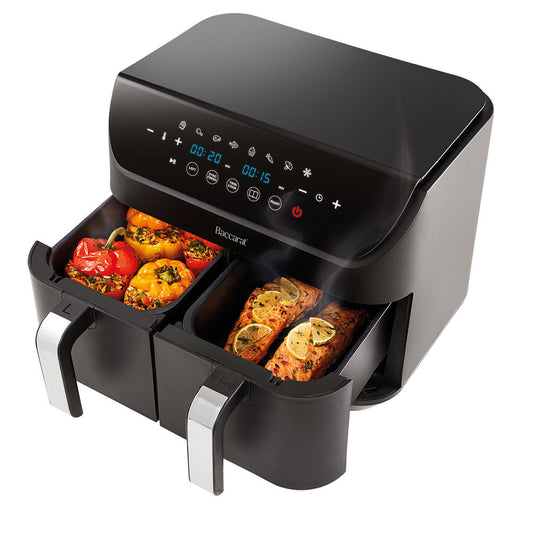 Close-up of a sleek black loaf bread maker with removable baskets and cooked potatoes - Baccarat