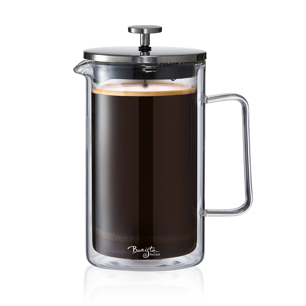 A clear Baccarat Double-Wall Coffee Press pitcher with a side handle perfect for serving beverages