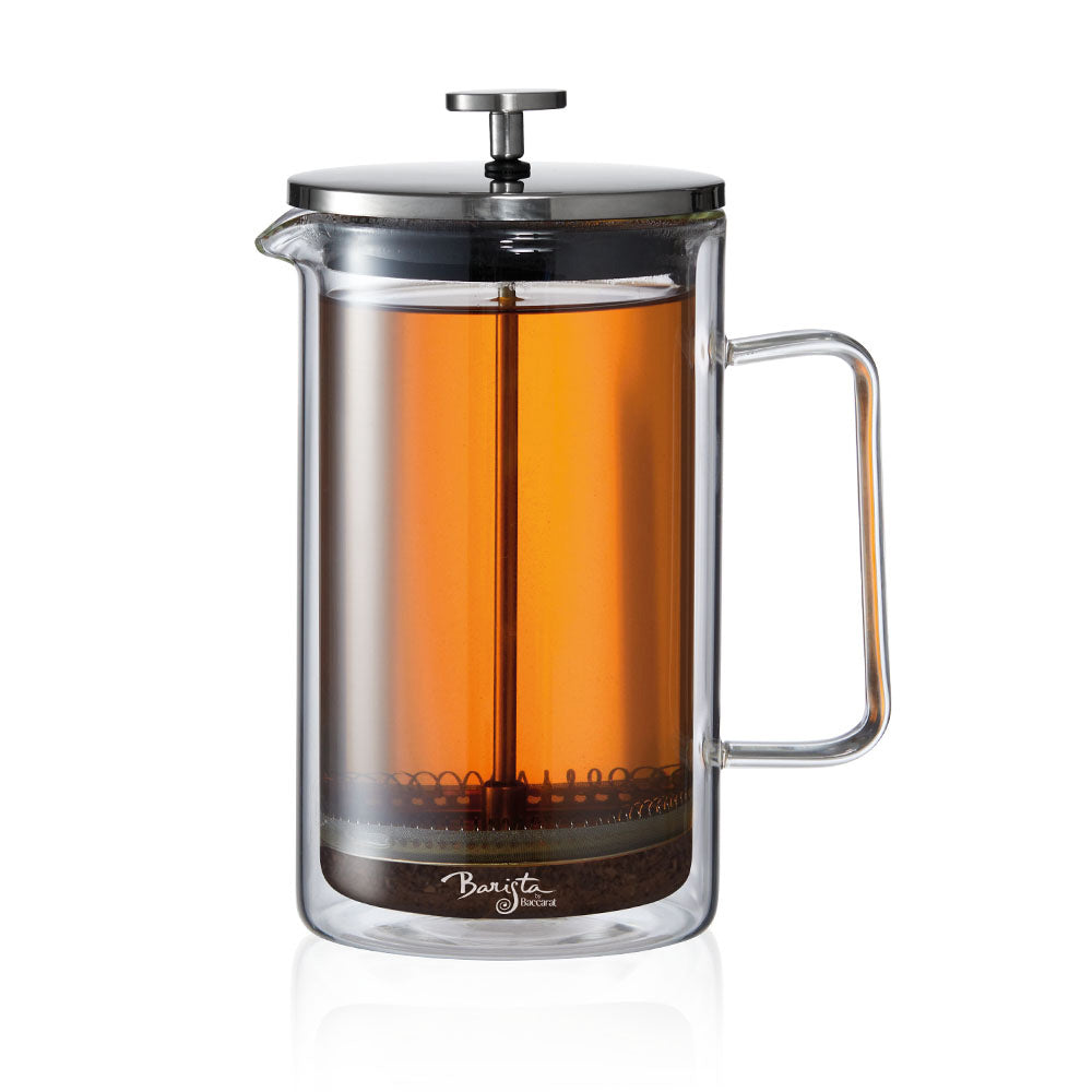 A clear Baccarat Double-Wall Coffee Press pitcher with a side handle perfect for serving beverages