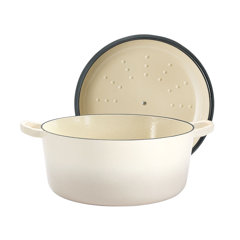 A beige pot lid with steam holes featuring a subtle black rim - Baccarat id3 rolling knife sharpener