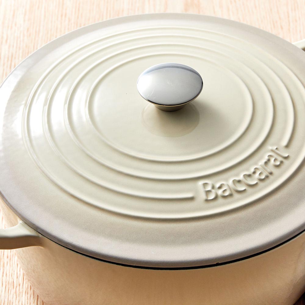 A beige pot lid with steam holes featuring a subtle black rim - Baccarat id3 rolling knife sharpener