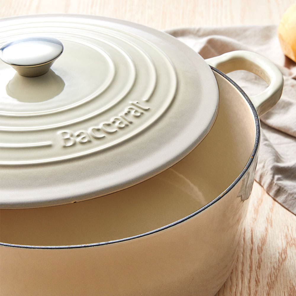 A beige pot lid with steam holes featuring a subtle black rim - Baccarat id3 rolling knife sharpener