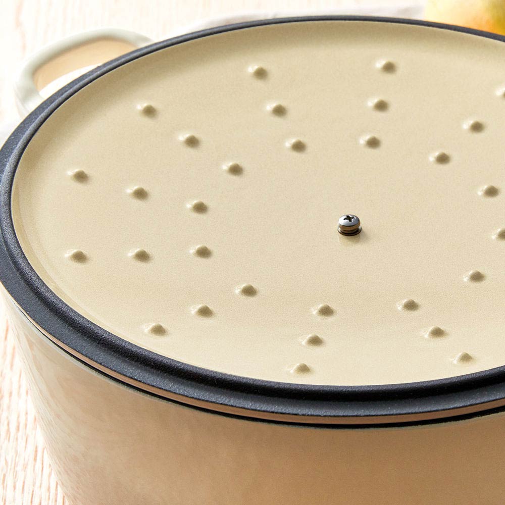 A beige pot lid with steam holes featuring a subtle black rim - Baccarat id3 rolling knife sharpener