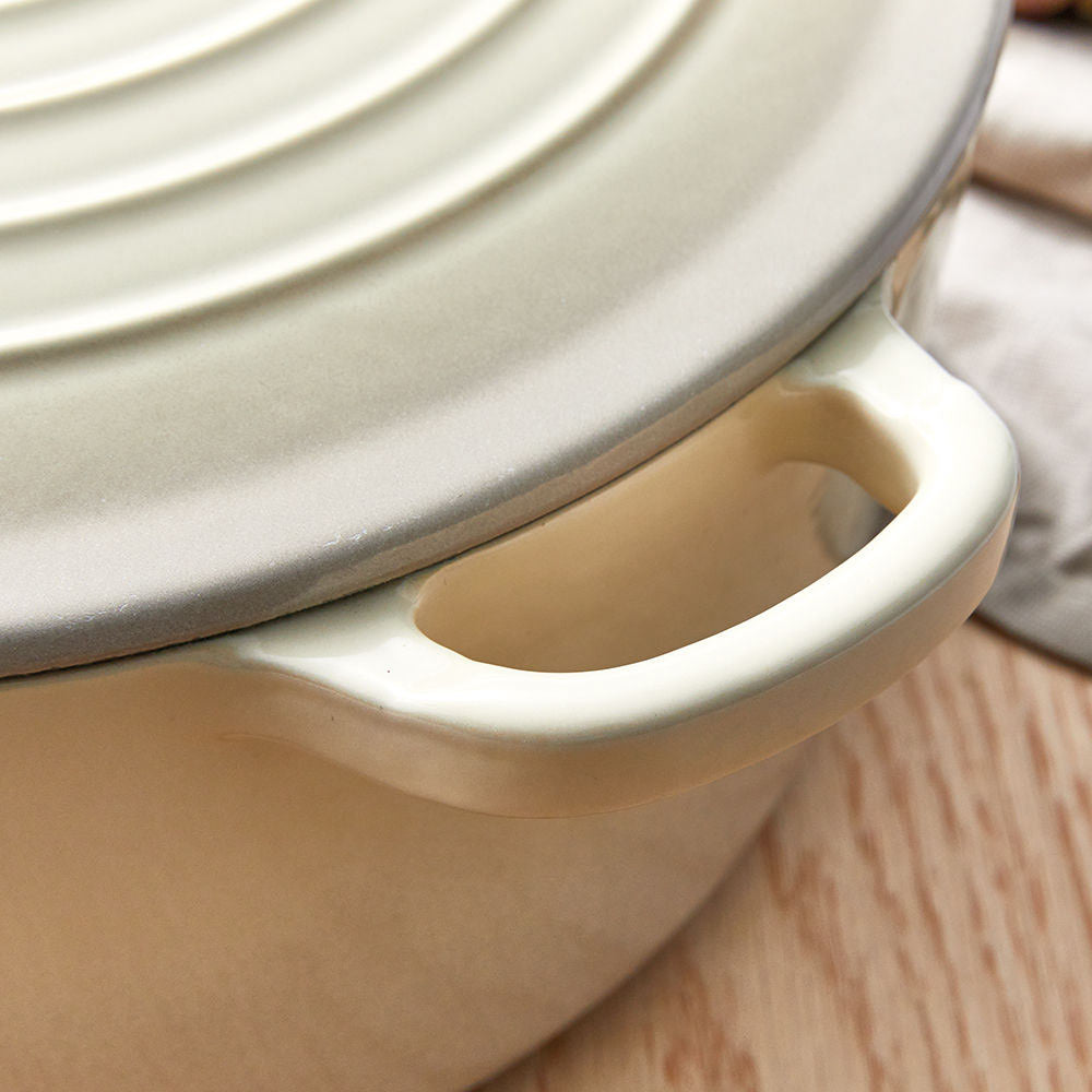 A beige pot lid with steam holes featuring a subtle black rim - Baccarat id3 rolling knife sharpener