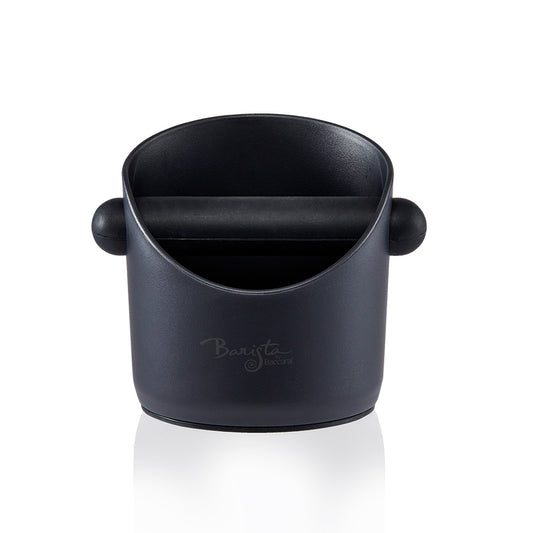 metal portafilter tapping coffee grounds into black knock box - Baccarat id3 Samurai cleaver 17 5cm