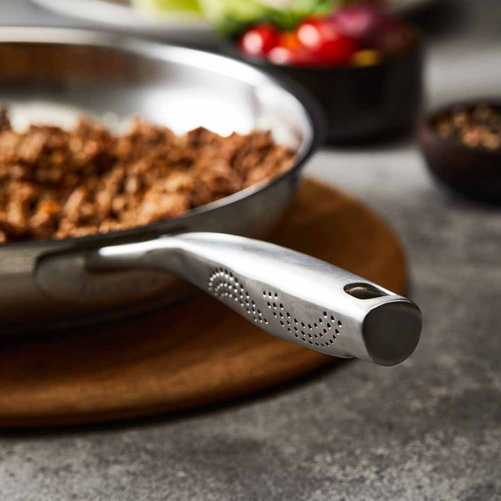 Baccarat id3 Stainless Steel 30cm Frypan with cooked ground beef on a table with tacos and salad