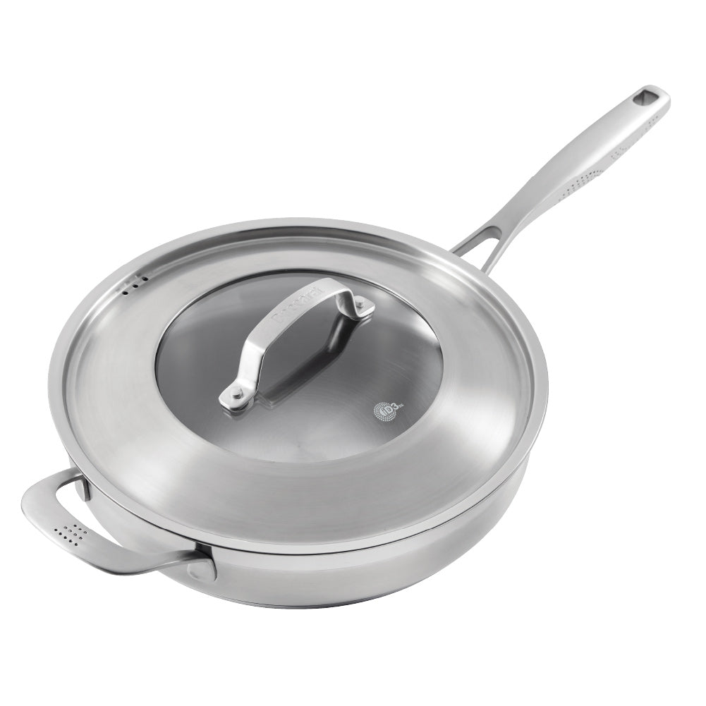 Close-up of a Baccarat id3 Saute Pan 28cm frypan with a glass lid and steam featuring silver handle