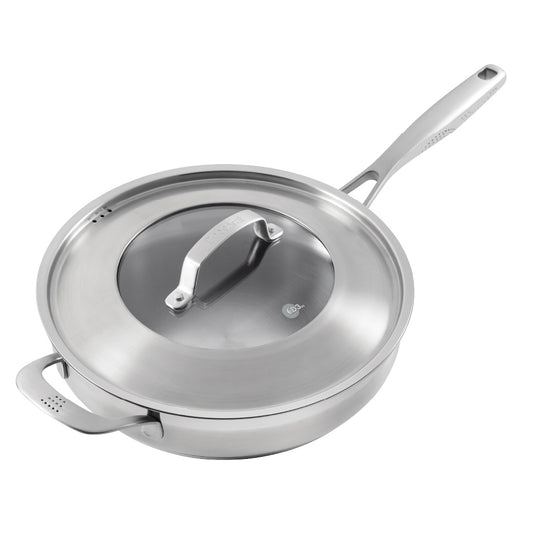 Close-up of a Baccarat id3 Saute Pan 28cm frypan with a glass lid and steam featuring silver handle